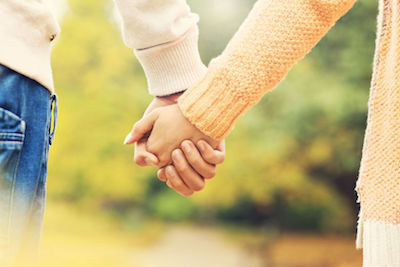 Couple holding hands